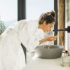 li-woman-washing-face-bathroom-pdp